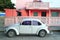 Caribbean pink house tropical retro car facade