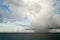 Caribbean Rain Cloud With A Rainbow