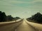 Caribbean road trip. A view south along the arterial road north of Cienfuegos in the north east of Cuba. The road is one of the