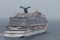 The Caribbean Sea - May 26, 2020: Aerial close-up shot of Carnival Vista anchored at sea in the fog. Grey foggy sky in the