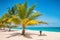 Caribbean travel summer vacation woman sunbathing on beach during cruise holiday. Luxury getaway on Dover Beach resort