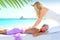 Caribbean turquoise beach massage woman