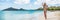 Caribbean vacation beach selfie woman panorama. Asian bikini girl taking self-portrait pictures on Jolly beach, Antigua and