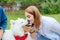 Caring appealing woman touching her cute fluffy husky