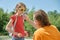 Caring dad helps his child, wipes his lips soiled with ice cream