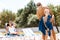 Caring daddy drying body of son after swimming in pool