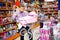 Caring father choosing pink baby doll stroller for gift to his daughter in children toy store