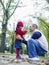 Caring Father With Daughter In Park