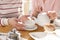 Caring girl having lunch with her granny