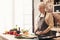 Caring grandmother preparing healthy lunch for family