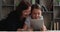 Caring granny and little granddaughter having fun using tablet device