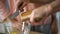 Caring husband cooking fresh vegetable salad, wife touching his hand gently