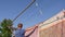 Caring husband hangs clothes on the street.