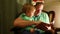 A caring and loving father reads his son a book before going to bed at home.