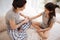 Caring mother applying ointment on the daughters hand at home