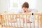 Caring mother sits on cot
