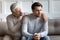 Caring old father comfort support unhappy adult son