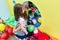 Caring teacher guiding a shy pre-school girl during playtime