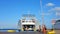 CARLOFORTE, ITALY - Jul 26, 2017: Ferry boat in Mediterranean port, loaded with passengers and cars, nearly ready to depart