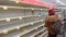 Carlsbad, CA / USA - March 13, 2020: A shopper in front of empty pasta shelves in a grocery store.