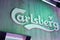 Carlsberg beer irish sign text and brand logo on facade wall building bar entrance pub