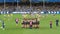 Carlton Blues players together in a huddle before starting a game against Geelong Cats, Melbourne