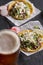 Carne asada beef tacos with queso fresco and beer