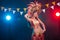 Carnival, dancer and holiday concept - Beauty brunette woman in cabaret suit and headdress with natural feathers and