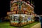 Carnival food stand lit up at night