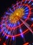 Carnival illuminated ferris wheel at night