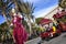 Carnival of Nice, Flowers` battle. A wader in red costume and a little train