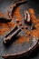 Carob carob fruit with powder on black background. Blast the Sweet powder from the pulp of the pods.