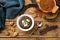 Carob pods and carob powder over wooden background