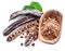 Carob pods and carob powder in the wooden bowl