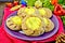 Carols with potatoes on napkin with Christmas toys