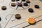 Carom board with striker, carom men, and queen.