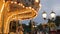 Carousel in amusement park ride glowing illuminated night shooting