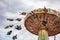 Carousel on cloudy sky background. Oktoberfest, Bavaria, Germany
