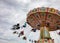 Carousel on cloudy sky background. Oktoberfest, Bavaria, Germany