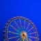Carousel. Ferris Wheel on a blue background.