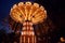 Carousel Merry-go-round in amusement park at a night city