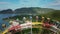 Carousel ride is fun and entertaining in an amusement park against the backdrop of a sunrise. View of people in a booth