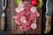 Carpaccio beef, with Radish and garnet, on wooden serving board, on old dark  wooden table background, top view flat lay