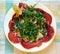 carpaccio of bresaola with salt, pepper, oil, arugula, flakes of parmesan and lemon