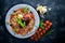 Carpaccio of fish, vegetables, cheese, spices, to Wooden background. Top view.