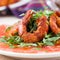 Carpaccio of grapefruit with rucola, arugula salad and spicy