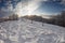 Carpathian mountains in the snow. Trees in the snow. Snowdrifts of snow. Sunset in the mountains. Beautiful clouds.
