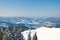 Carpathian mountains, Ukraine. Wonderful snow-covered firs against the backdrop of mountain peaks. Panoramic view of the