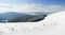 Carpathian mountains, Ukraine. Wonderful snow-covered firs against the backdrop of mountain peaks. Panoramic view of the