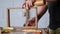 A carpenter assembles a wooden oak box to join it on a dovetail. the sounds of hand carpentry tool